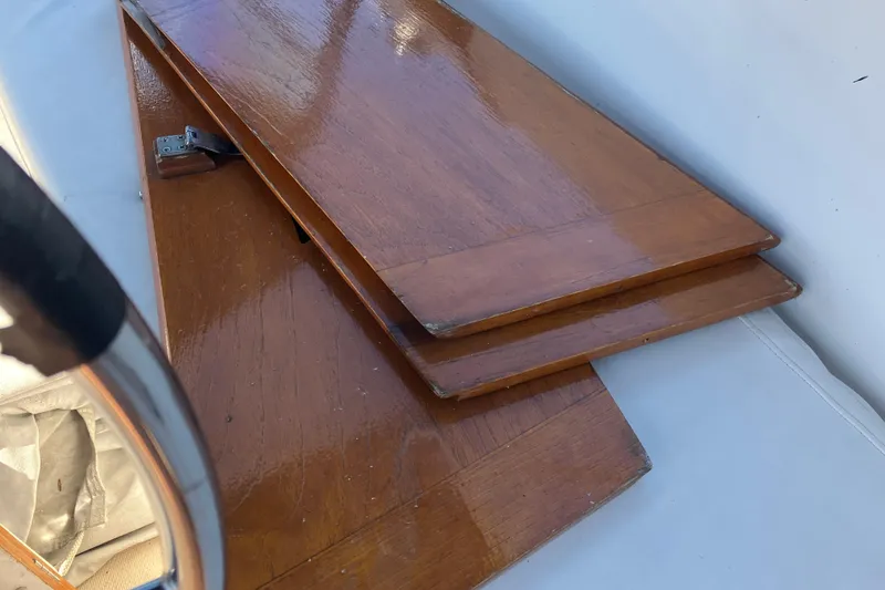 Slide: The Image of Polished wooden hatch cover on 1985 Catalina 30 sailboat deck. - 13