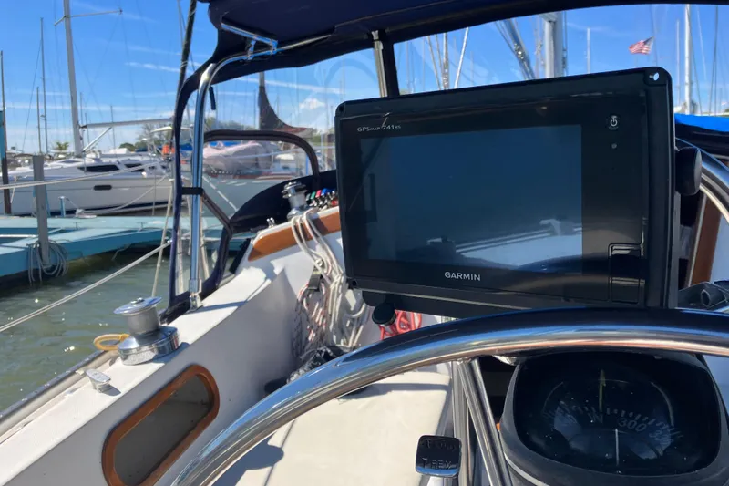 Slide: The Image of Cockpit of 1985 Catalina 30 sailboat with Garmin GPS and compass, docked at marina. - 10