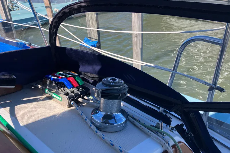 Slide: The Image of Cockpit of 1985 Catalina 30 sailboat with winch and colorful rope clutches. - 18
