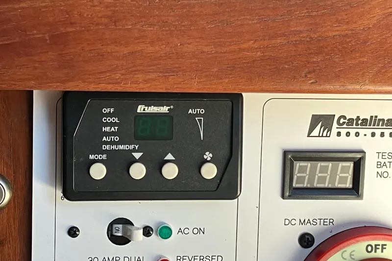 Slide: The Image of Control panel of a 1985 Catalina 30 boat with Crusair system settings. - 34