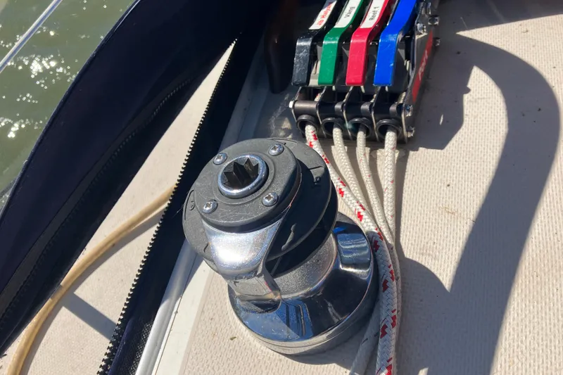Slide: The Image of Winch and rope clutches on 1985 Catalina 30 sailboat deck. - 15