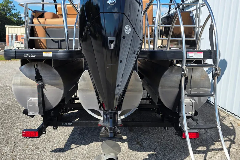 Slide: The Image of Rear view of a 2021 Godfrey Monaco 235 SFL pontoon boat with dual propellers. - 11
