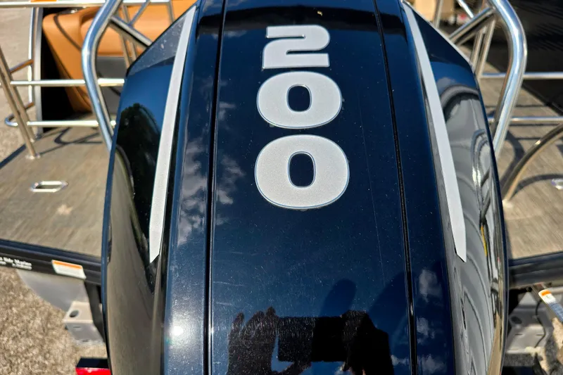 Slide: The Image of Outboard motor with "200" label on a 2021 Godfrey Monaco 235 SFL boat. - 12