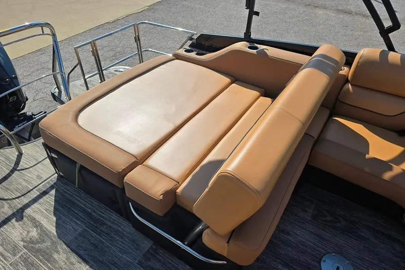 Slide: The Image of 2021 Godfrey Monaco 235 SFL boat with tan leather seating and sleek design. - 6