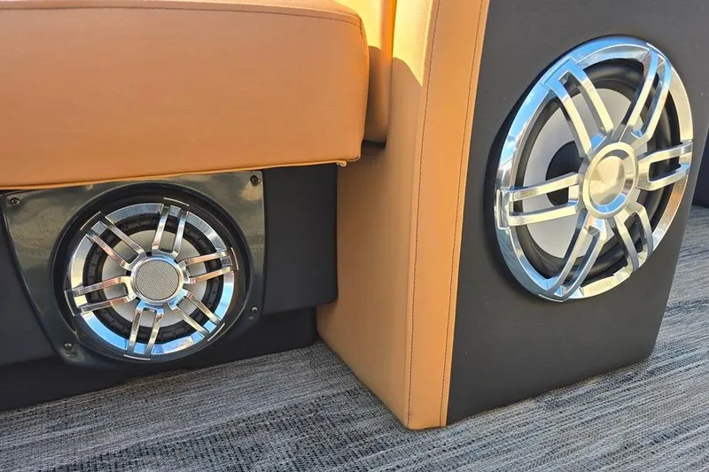 Slide: The Image of 2021 Godfrey Monaco 235 SFL boat speakers with chrome accents and tan upholstery. - 8