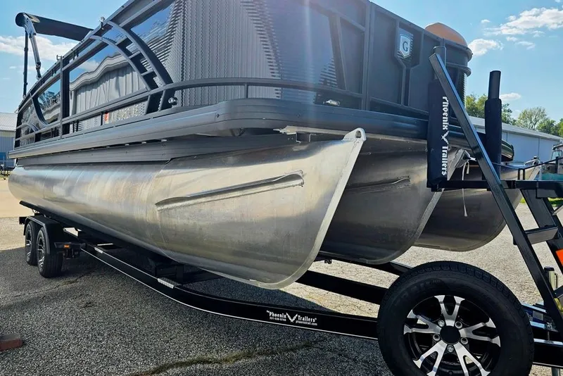 Slide: The Image of 2021 Godfrey Monaco 235 SFL pontoon boat on trailer, parked outdoors. - 9