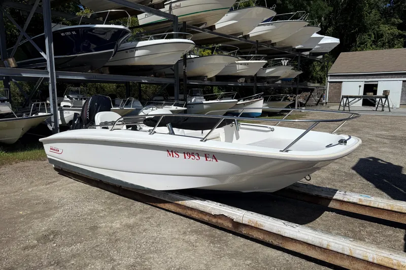 Slide: The Image of 2013 Boston Whaler 150 Super Sport boat on outdoor storage rack. - 4