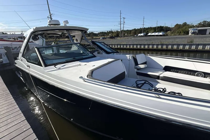 The Image of 2020 Monterey 378SS Super Sport boat docked, showcasing sleek design and spacious seating. - 1