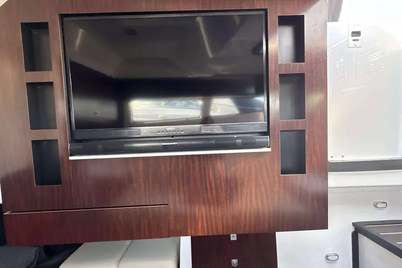 Slide: The Image of 2020 Monterey 378SS Super Sport interior with built-in TV and wooden paneling. - 14