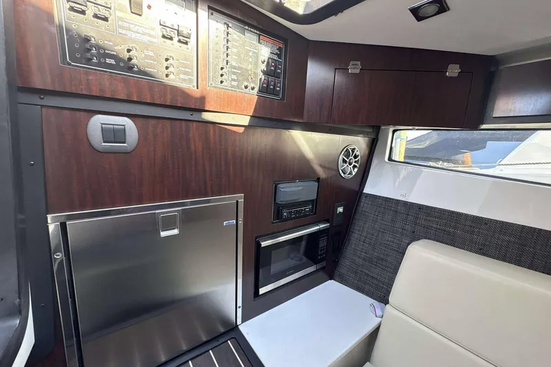 Slide: The Image of Interior of 2020 Monterey 378SS Super Sport boat with modern amenities and control panels. - 15