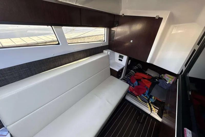 Slide: The Image of Interior cabin of 2020 Monterey 378SS Super Sport boat with seating and storage. - 17