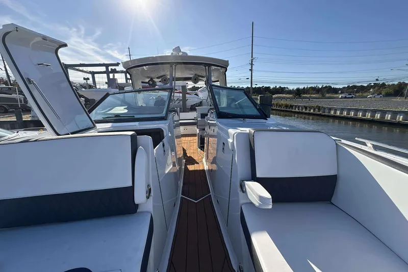 Slide: The Image of 2020 Monterey 378SS Super Sport boat interior with white seating and open deck. - 19