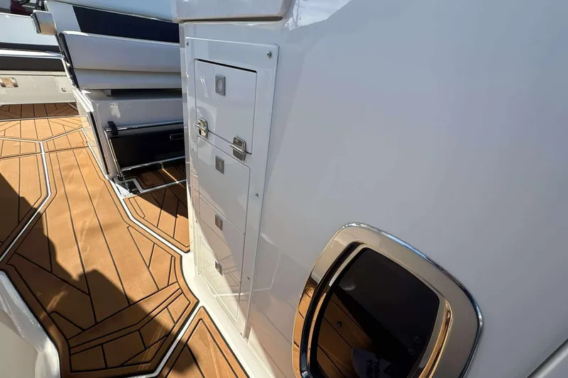 Slide: The Image of 2020 Monterey 378SS Super Sport boat interior with sleek design and wood-patterned flooring. - 23