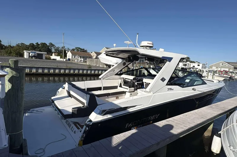Slide: The Image of 2020 Monterey 378SS Super Sport boat docked at marina under clear blue sky. - 3