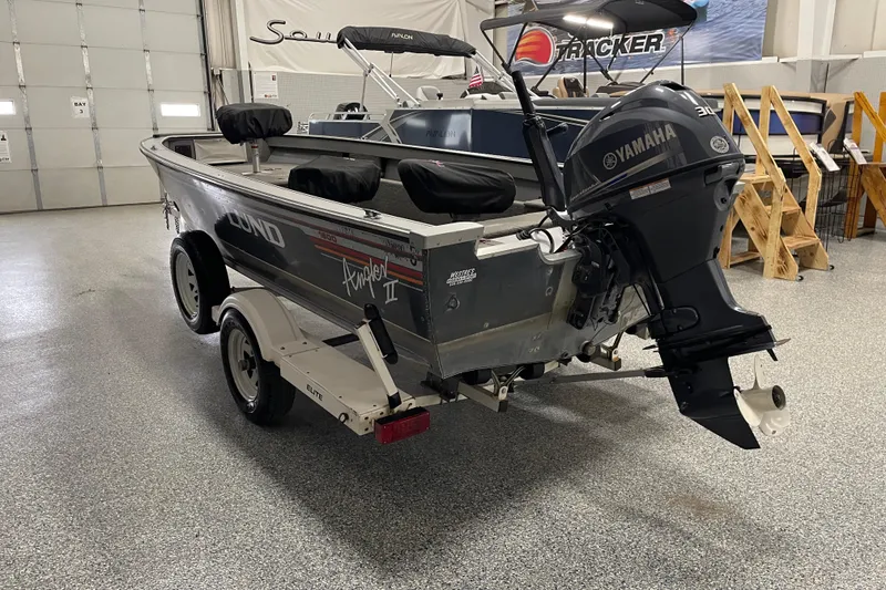 Slide: The Image of Yamaha 30 horsepower outboard motor on a 1993 Lund 1600 Angler boat. - 4