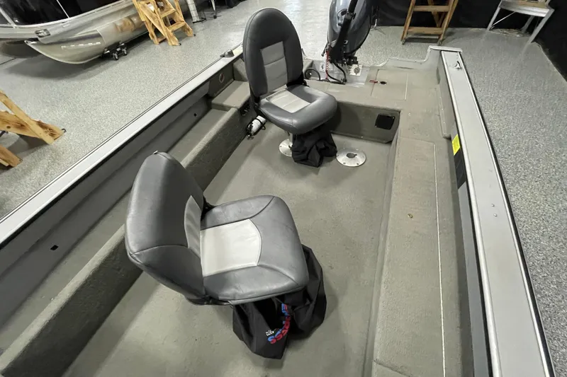 Slide: The Image of Open storage compartment in 1993 Lund 1600 Angler boat, showcasing interior space. - 7