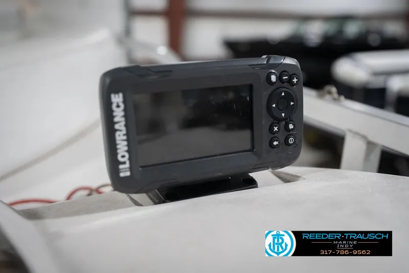 Slide: The Image of Lowrance device on 1999 Landau DX24 boat, Reeder-Trausch Marine logo visible. - 36