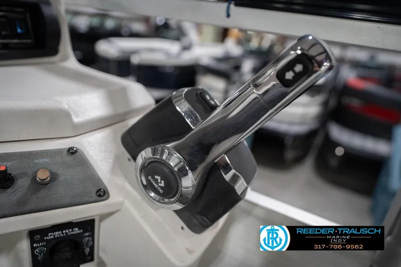 Slide: The Image of Close-up of a 1999 Landau DX24 boat throttle control with Dometic branding. - 38