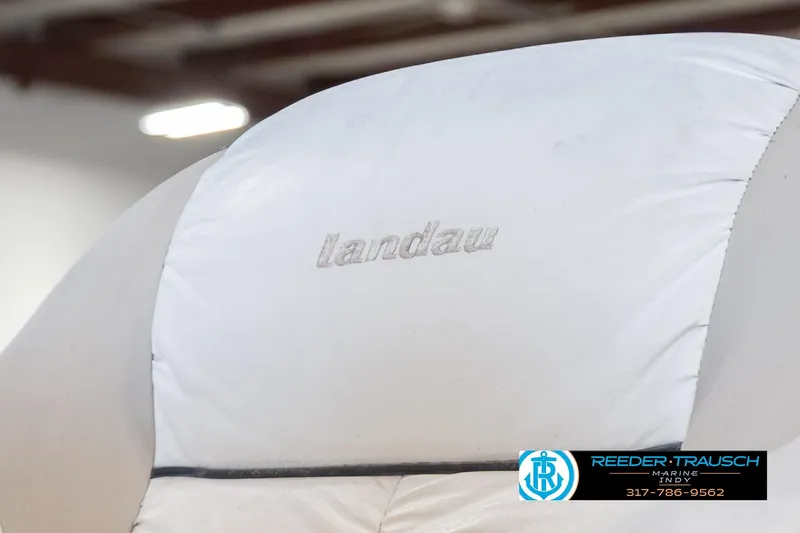 Slide: The Image of 1999 Landau DX24 boat seat with embroidered logo, Reeder Trausch Marine contact info visible. - 40