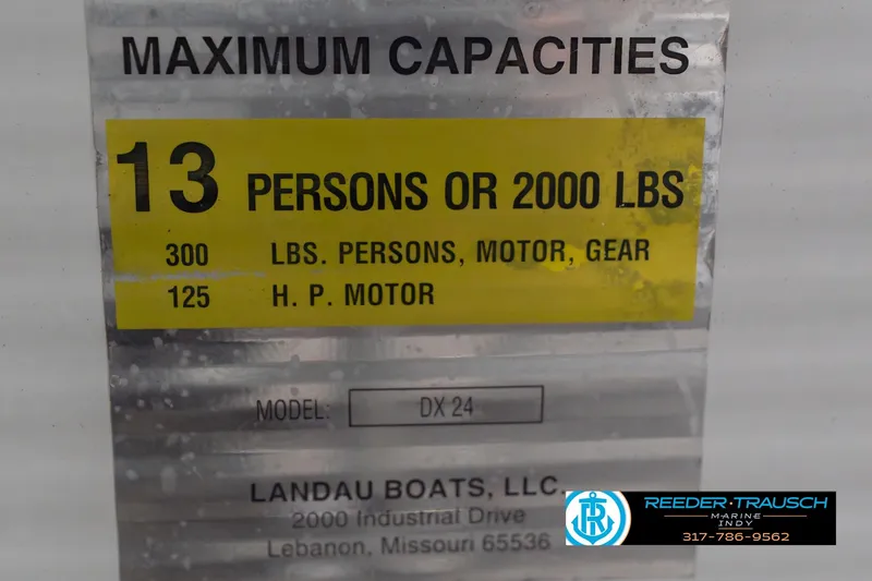 Slide: The Image of 1999 Landau DX24 capacity plate: 13 persons or 2000 lbs, 125 HP motor limit. - 60