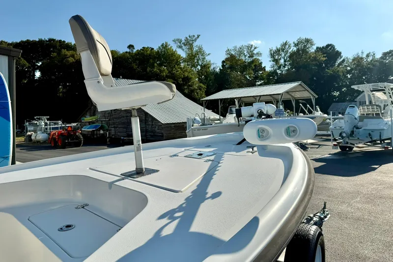 Slide: The Image of 2022 Key West 188 Bay Reef boat with elevated seat, parked outdoors. - 14