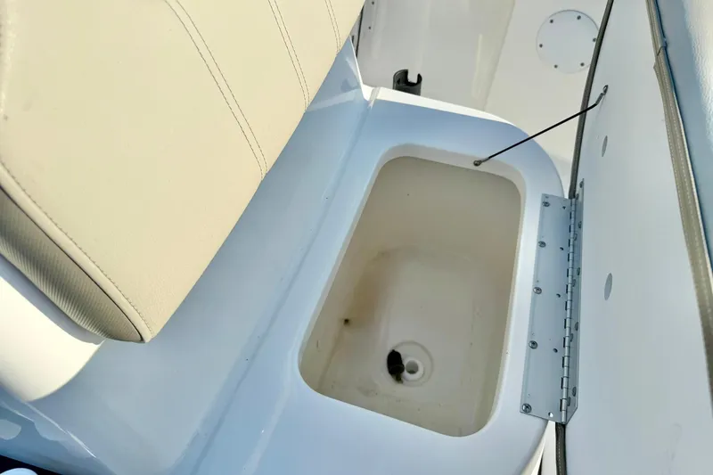 Slide: The Image of 2022 Key West 188 Bay Reef boat storage compartment with open lid. - 17