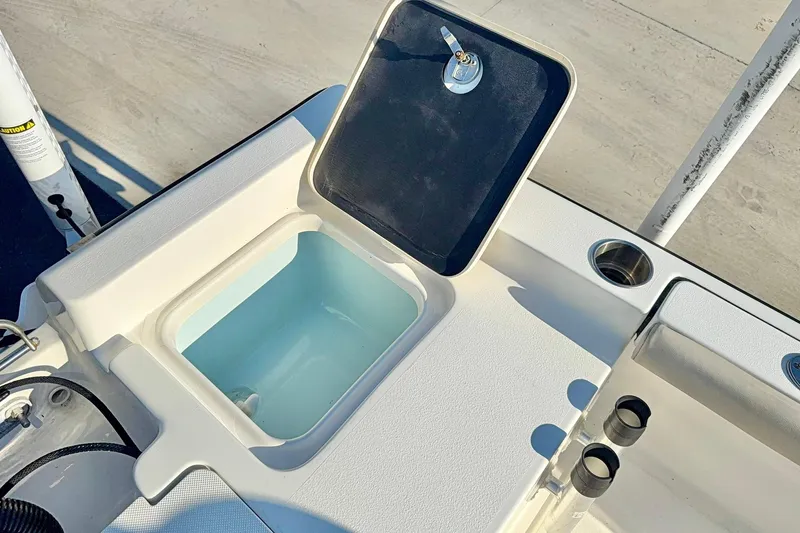 Slide: The Image of 2022 Key West 188 Bay Reef boat livewell with open lid, showcasing interior. - 28