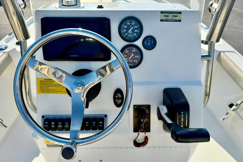 Slide: The Image of Steering console of 2022 Key West 188 Bay Reef boat with gauges and controls. - 3