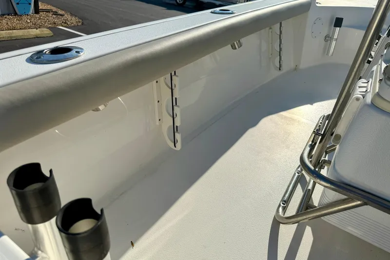 Slide: The Image of 2022 Key West 188 Bay Reef boat interior with rod holders and seating. - 32