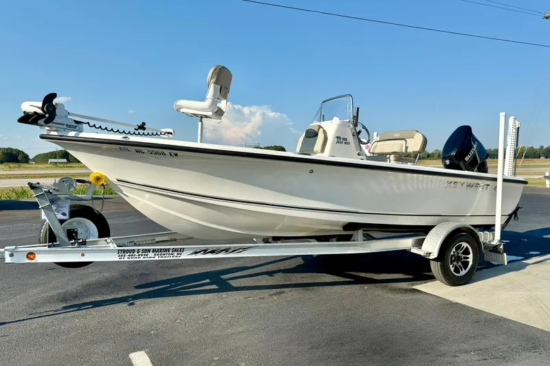 Slide: The Image of 2022 Key West 188 Bay Reef boat on trailer, parked outdoors. - 5