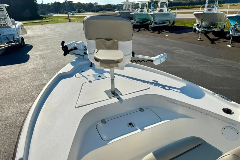 Slide: The Image of 2022 Key West 188 Bay Reef boat with front seating and trolling motor in a marina. - 9