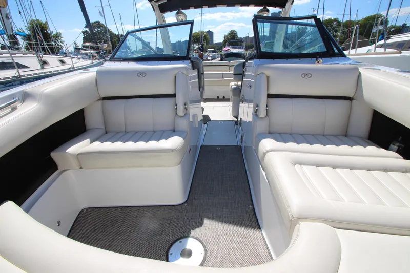 Slide: The Image of 2016 Cobalt R30 boat interior with white leather seating and open deck layout. - 16