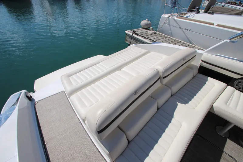 Slide: The Image of 2016 Cobalt R30 boat with luxurious white seating on a sunny day by the water. - 32