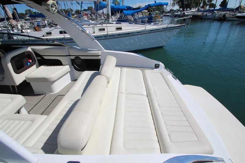 Slide: The Image of Luxurious 2016 Cobalt R30 boat with spacious white seating at a marina. - 35