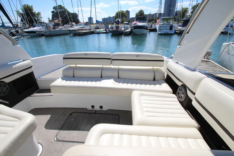 Slide: The Image of Luxurious 2016 Cobalt R30 boat interior with plush seating, docked at a marina. - 39