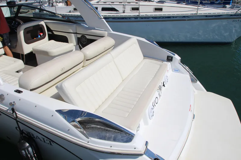 Slide: The Image of 2016 Cobalt R30 boat with white seating and sleek design in a marina. - 6