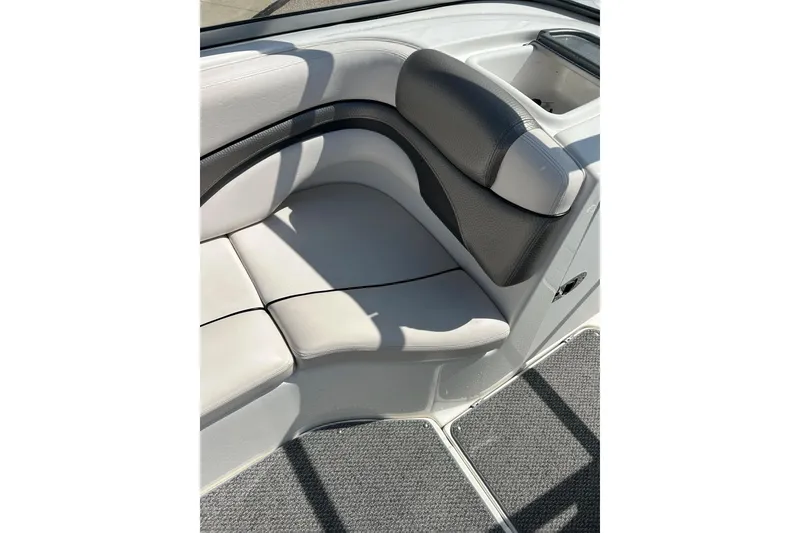 Slide: The Image of 2008 Yamaha 212X boat interior seating with gray upholstery and carpeted flooring. - 18