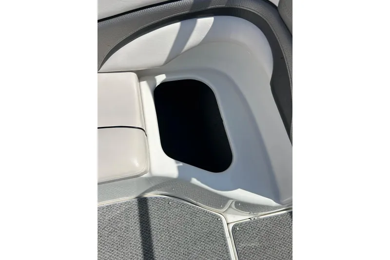 Slide: The Image of Interior storage compartment of 2008 Yamaha 212X boat, featuring sleek design and upholstery. - 19