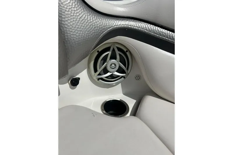 Slide: The Image of Interior of 2008 Yamaha 212X boat featuring speaker and cup holder. - 21