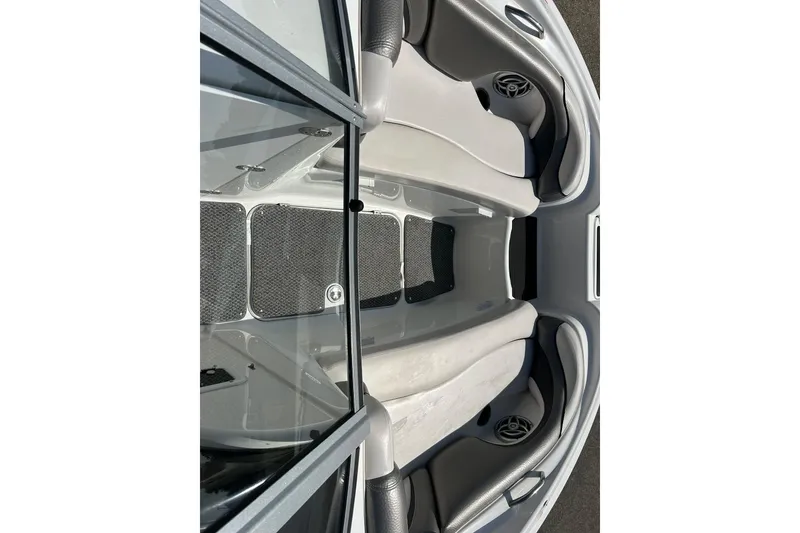 Slide: The Image of Interior view of a 2008 Yamaha 212X boat, featuring seating and speaker details. - 22