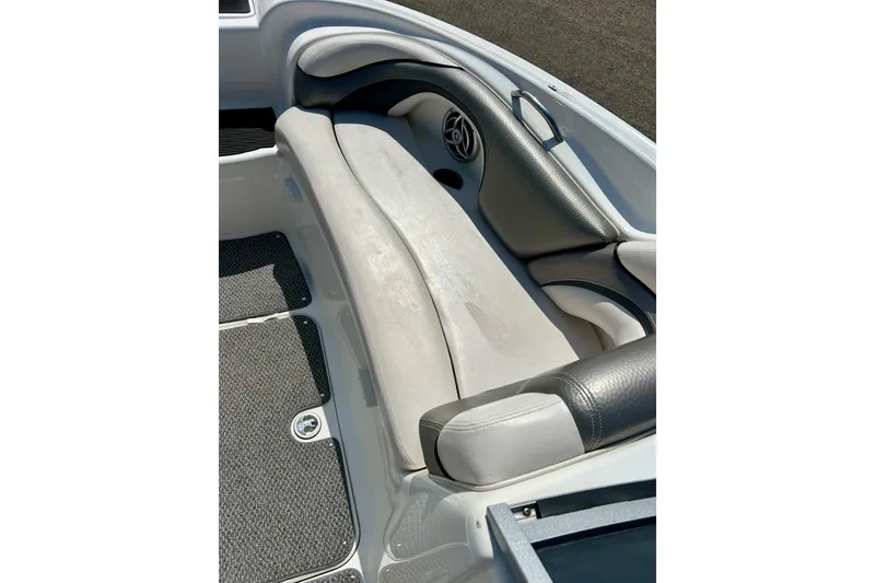 Slide: The Image of 2008 Yamaha 212X boat interior with cushioned seating and speaker detail. - 24