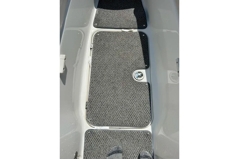 Slide: The Image of 2008 Yamaha 212X boat interior with textured flooring and storage compartment. - 26