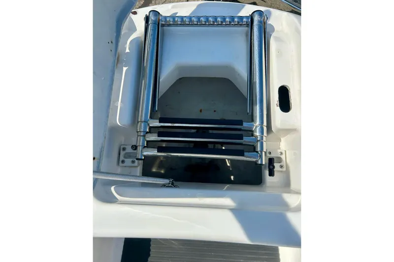 Slide: The Image of Folded metal ladder on a 2008 Yamaha 212X boat deck. - 36