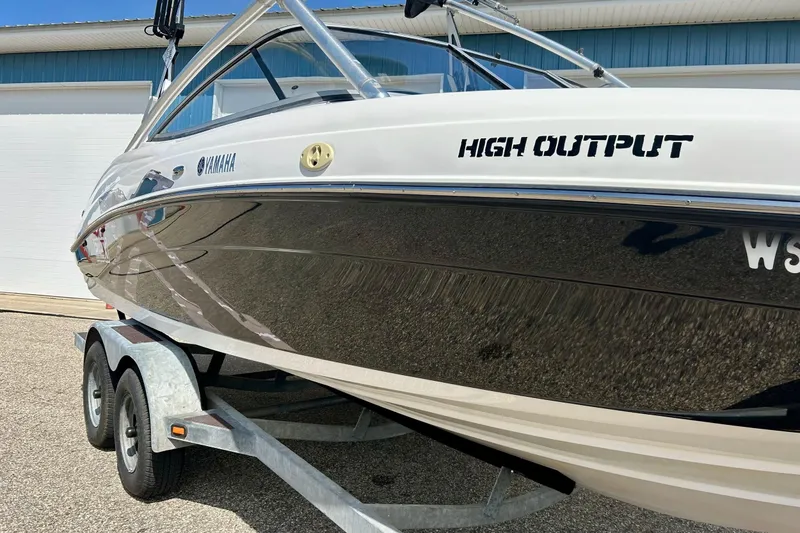 Slide: The Image of 2008 Yamaha 212X boat on trailer, high output model, parked outdoors. - 5