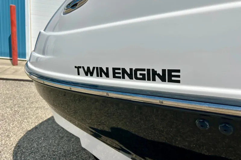 Slide: The Image of 2008 Yamaha 212X boat with "Twin Engine" label, close-up view. - 8