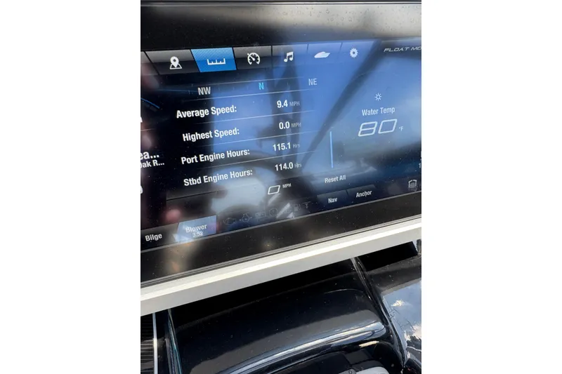 Slide: The Image of Dashboard of 2022 Yamaha Boats 255XD showing speed, engine hours, and water temperature. - 7