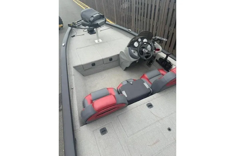 Slide: The Image of 2008 Tracker Pro Team 175 TXW boat interior with steering console and seating. - 2