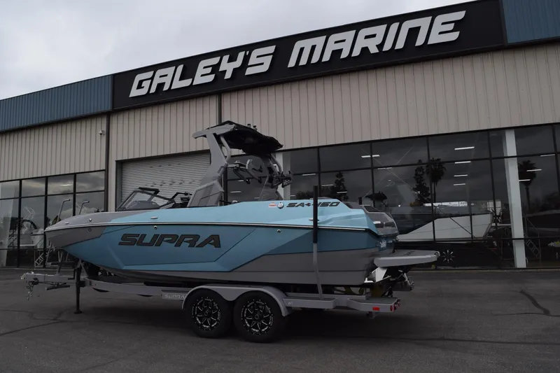 The Image of 2025 Supra SA boat displayed outside Galey's Marine dealership. - 0