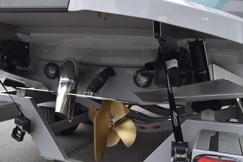 Slide: The Image of Rear view of 2025 Supra SA boat showing propeller and exhaust system. - 11