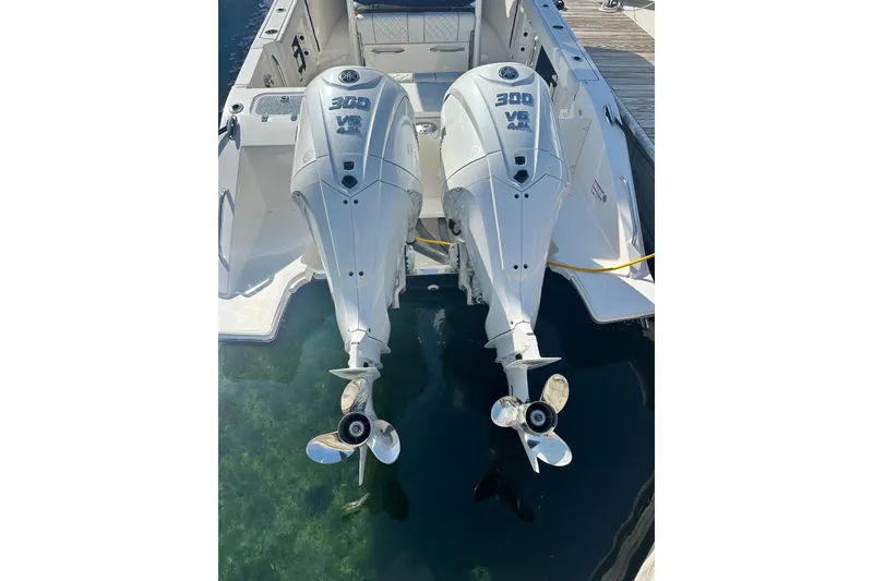 Slide: The Image of 2024 Pursuit S 288 Sport boat with dual 300 V6 outboard engines. - 3